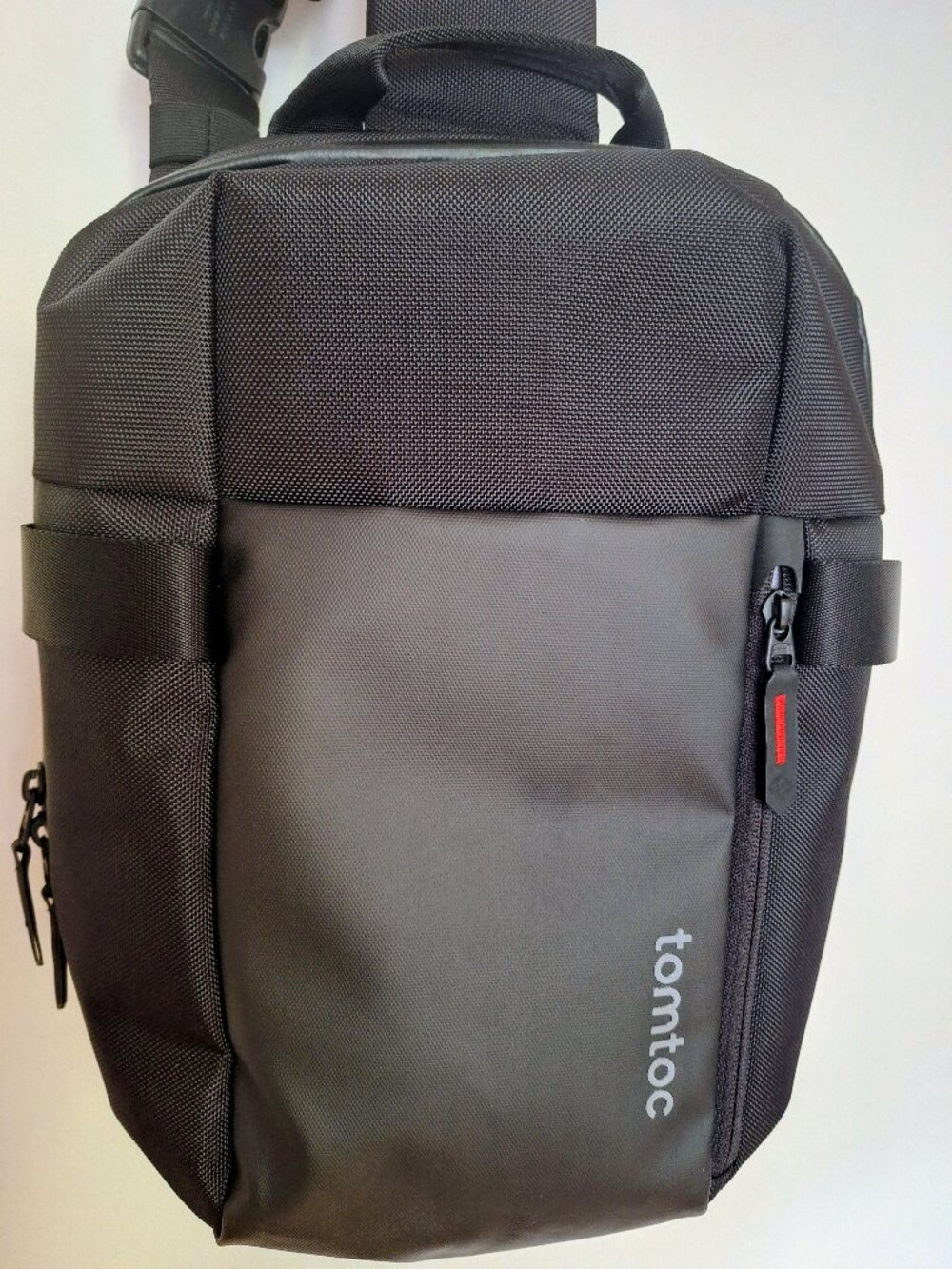 Tomtoc backpack with adjustable shoulder strap and padded back